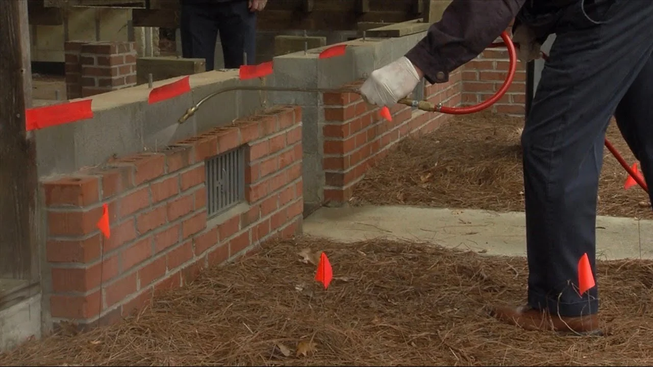 Seasonal perimeter treatment being applied around residential property